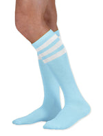 Load image into Gallery viewer, Unisex adult size light baby blue knee high tube sock with three white stripes
