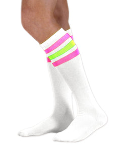 Unisex adult size white knee high tube sock with three fluorescent neon pink and neon green stripes