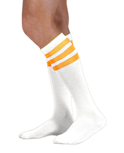 Unisex adult size white knee high tube sock with three fluorescent neon orange stripes